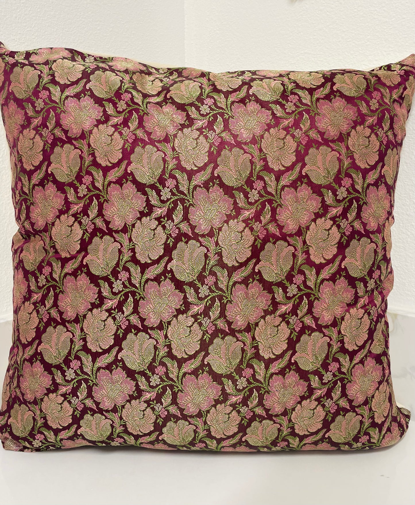 Floral patterned pillow on a white background